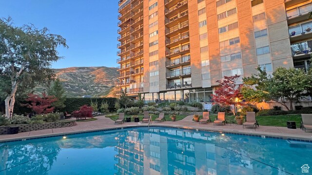 875 S Donner Way E Unit 111, Salt Lake City, UT 84108 - community pool featuring a mountain view