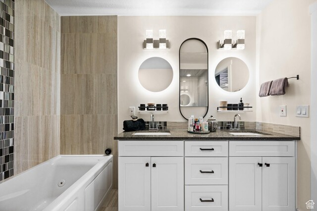 875 S Donner Way E Unit 111, Salt Lake City, UT 84108 - full bathroom with a jetted tub, double vanity, and a sink