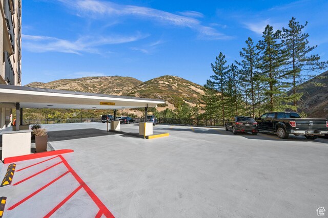 875 S Donner Way E Unit 111, Salt Lake City, UT 84108 - uncovered parking lot featuring a mountain view