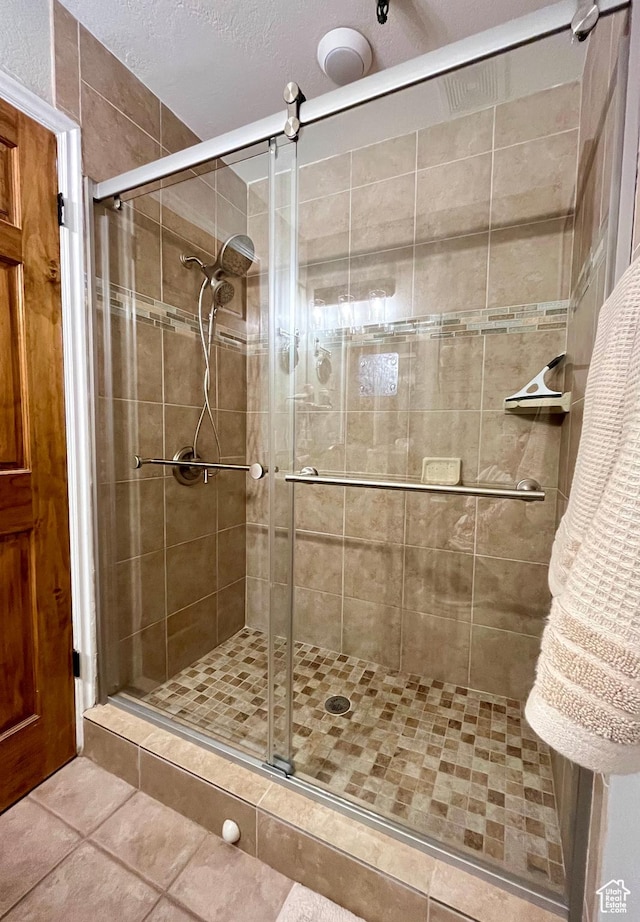 1940 Prospector Ave Unit 307, Park City, UT 84060 - bathroom featuring a shower stall and tile patterned flooring