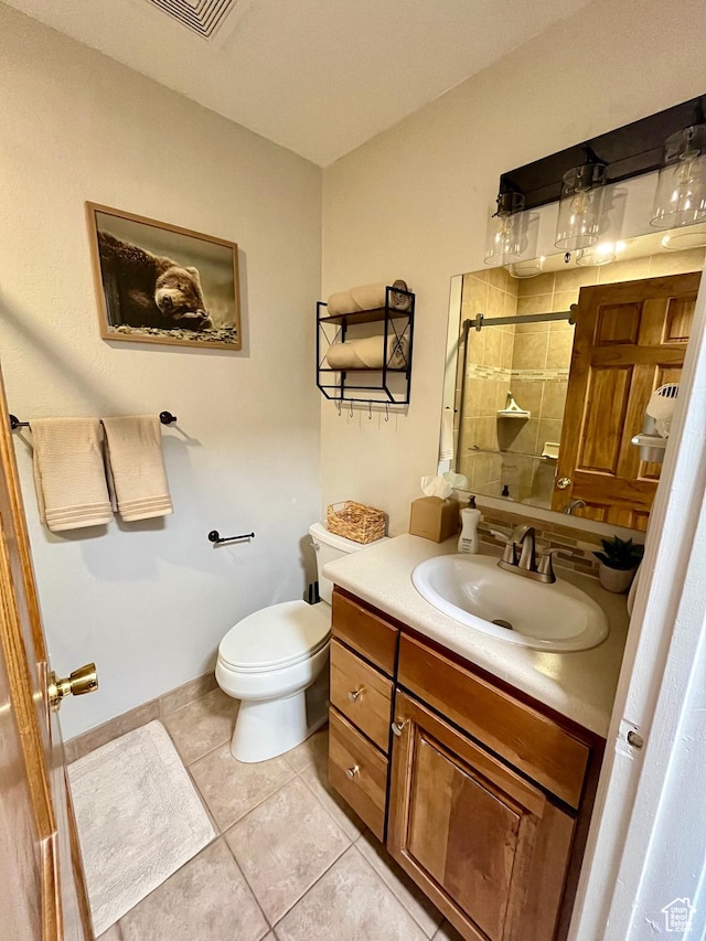 1940 Prospector Ave Unit 307, Park City, UT 84060 - bathroom with a tile shower, toilet, tile patterned flooring, and vanity