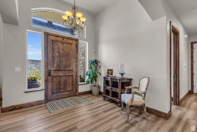 7759 Susans Cir, Park City, UT 84098 - entryway with light wood-style flooring, baseboards, and a chandelier