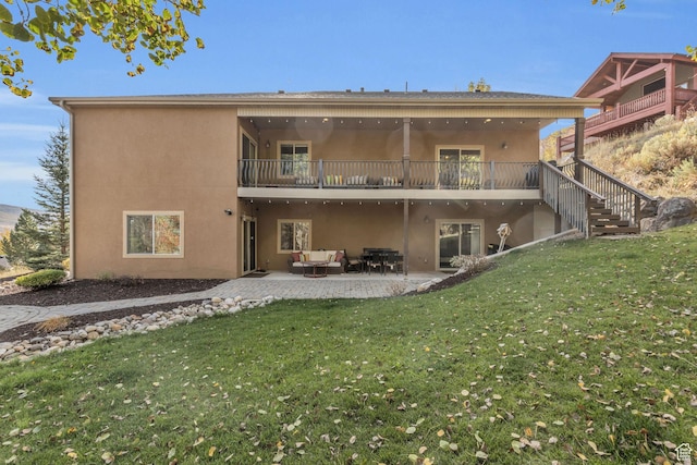 7759 Susans Cir, Park City, UT 84098 - back of house featuring a lawn, a balcony, and stucco siding