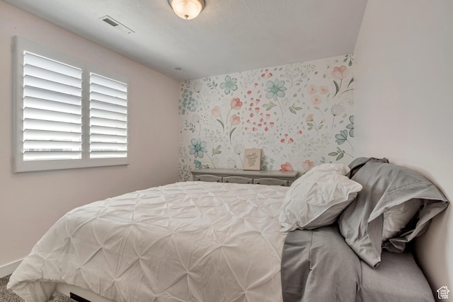 bedroom featuring visible vents