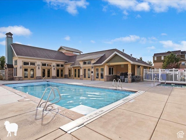 1138 N Shepard Creek Pkwy W Unit 2, Farmington, UT 84025 - community pool featuring french doors, fence, and a patio