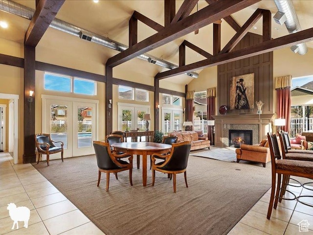 1138 N Shepard Creek Pkwy W Unit 2, Farmington, UT 84025 - dining area featuring french doors, high vaulted ceiling, light tile patterned flooring, beamed ceiling, and a glass covered fireplace
