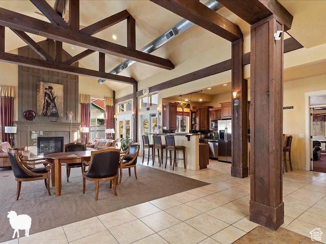 1138 N Shepard Creek Pkwy W Unit 2, Farmington, UT 84025 - dining space featuring a glass covered fireplace, light tile patterned floors, high vaulted ceiling, beam ceiling, and recessed lighting