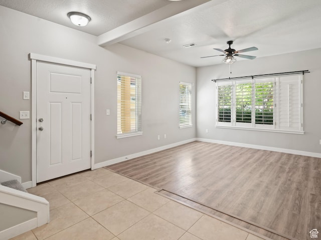 1138 N Shepard Creek Pkwy W Unit 2, Farmington, UT 84025 - foyer with ceiling fan, light tile patterned floors, a textured ceiling, baseboards, and stairway