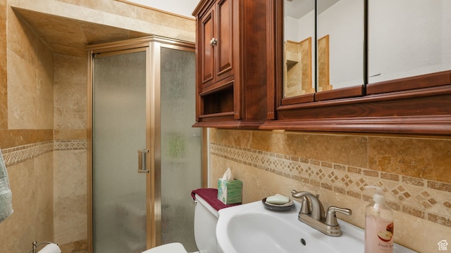 3640 E Aurora Cir, Salt Lake City, UT 84124 - bathroom featuring decorative backsplash, toilet, a sink, a shower stall, and tile walls