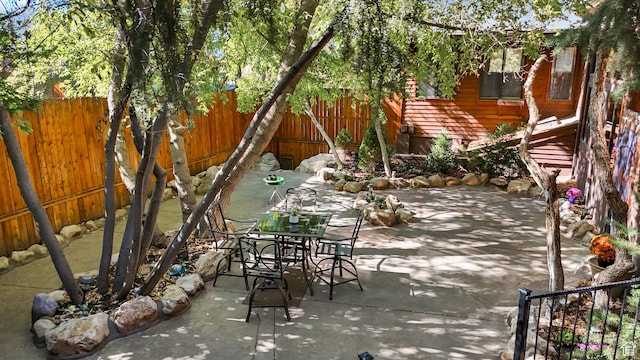 3640 E Aurora Cir, Salt Lake City, UT 84124 - view of patio / terrace featuring a fenced backyard and outdoor dining area