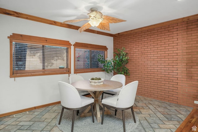 3640 E Aurora Cir, Salt Lake City, UT 84124 - dining space featuring visible vents, baseboards, brick wall, ceiling fan, and stone tile flooring
