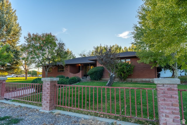 452 S 100 W, Salina, UT 84654 - view of front of house with fence private yard, a front lawn, and brick siding