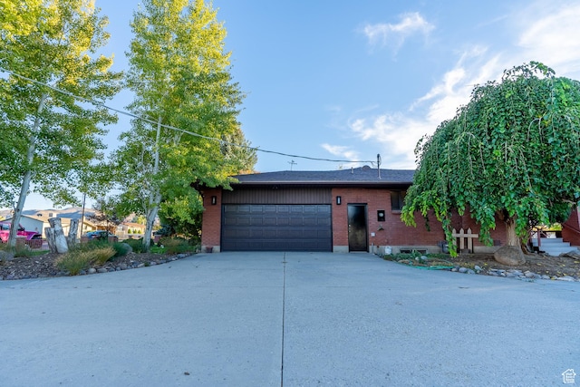 452 S 100 W, Salina, UT 84654 - ranch-style house with brick siding, an attached garage, and concrete driveway