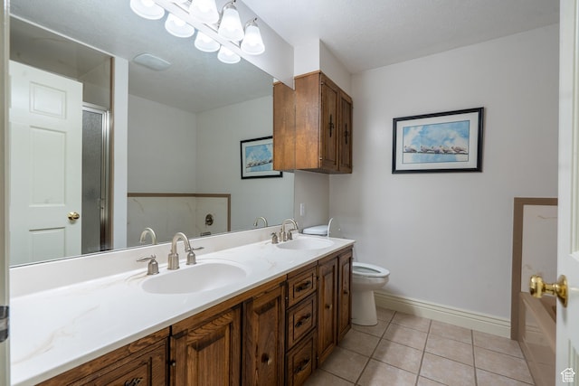452 S 100 W, Salina, UT 84654 - bathroom with double vanity, baseboards, a sink, and tile patterned flooring