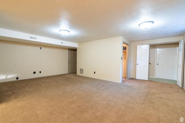452 S 100 W, Salina, UT 84654 - finished below grade area with a textured ceiling, visible vents, and light carpet