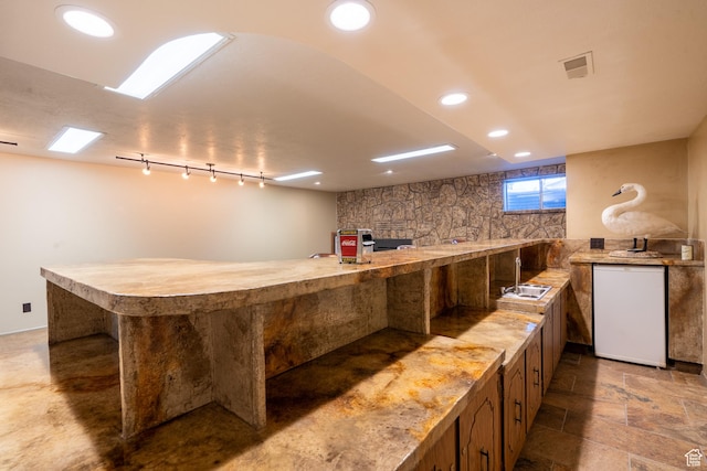 452 S 100 W, Salina, UT 84654 - interior space featuring fridge, a sink, light countertops, stone finish flooring, and visible vents