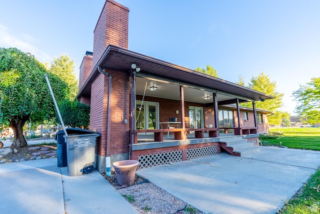 452 S 100 W, Salina, UT 84654 - exterior space featuring brick siding, covered porch, and a chimney