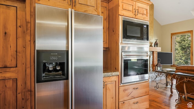 4170 Moosehollow Rd, Park City, UT 84098 - kitchen featuring appliances with stainless steel finishes, wood finished floors, and lofted ceiling