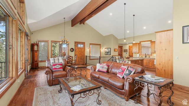 4170 Moosehollow Rd, Park City, UT 84098 - living area with high vaulted ceiling, plenty of natural light, beam ceiling, and wood finished floors