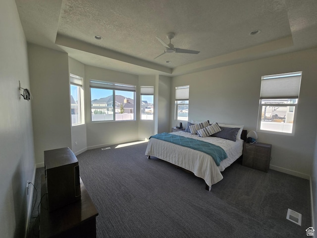 697 N 3275 W, Layton, UT 84041 - bedroom featuring a raised ceiling, carpet flooring, a textured ceiling, and a ceiling fan