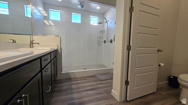697 N 3275 W, Layton, UT 84041 - full bathroom featuring a stall shower, wood finished floors, and double vanity