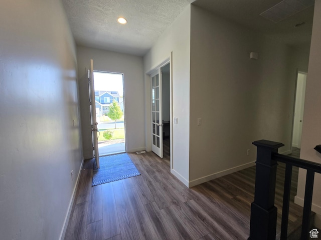 697 N 3275 W, Layton, UT 84041 - foyer entrance featuring dark wood-type flooring, a textured ceiling, and recessed lighting
