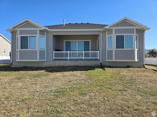 697 N 3275 W, Layton, UT 84041 - rear view of property featuring a lawn, stucco siding, and roof with shingles