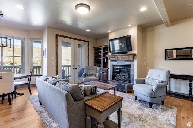 3126 Lower Saddleback Rd, Park City, UT 84098 - living room featuring light wood-type flooring, french doors, a fireplace, and recessed lighting