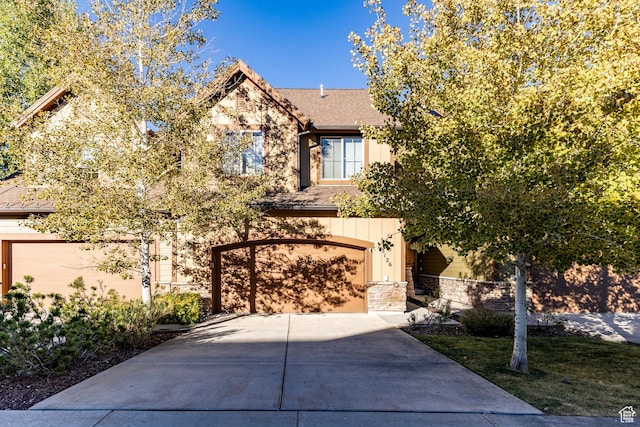 3126 Lower Saddleback Rd, Park City, UT 84098 - view of front of property featuring stone siding, driveway, roof with shingles, and a garage