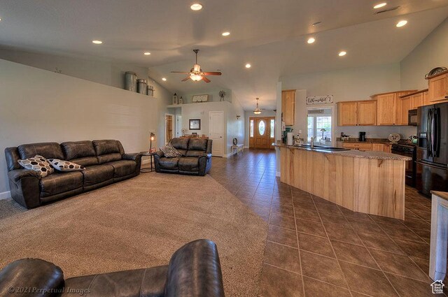 2304 Spanish Valley Dr, Moab, UT 84532 - living area featuring ceiling fan, dark tile patterned floors, recessed lighting, high vaulted ceiling, and baseboards