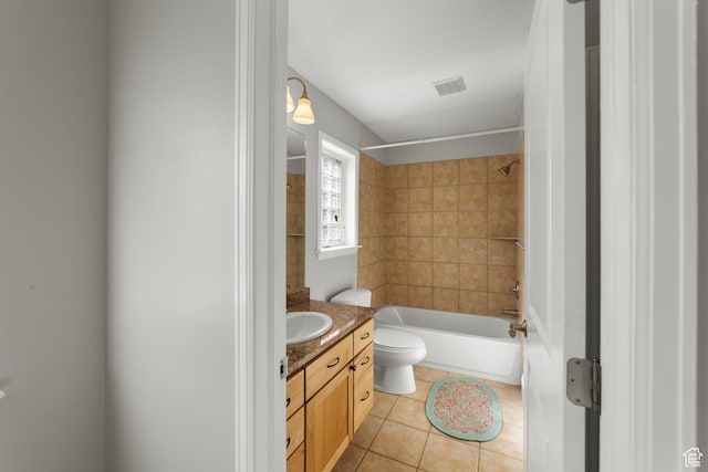 bathroom with vanity, tile patterned floors, toilet, and shower / washtub combination