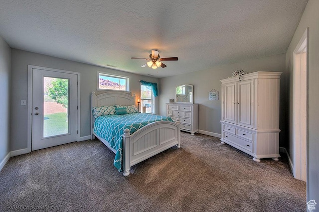 bedroom featuring access to outside, dark carpet, a textured ceiling, baseboards, and ceiling fan