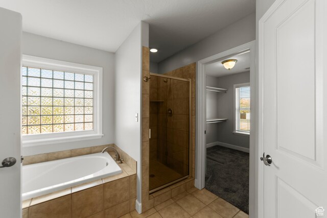 2304 Spanish Valley Dr, Moab, UT 84532 - full bathroom featuring a stall shower, tile patterned flooring, and a garden tub