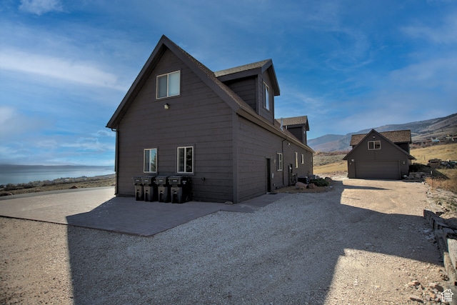 21 Gentle Ben Cir, Fish Haven, ID 83287 - view of side of property featuring an outdoor structure, a garage, and a mountain view