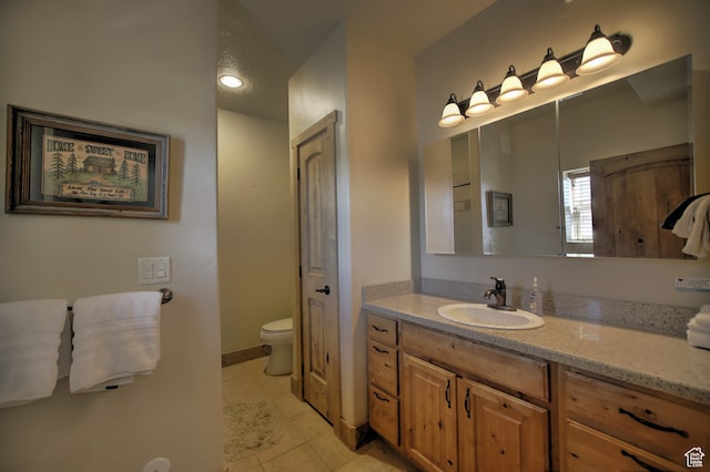21 Gentle Ben Cir, Fish Haven, ID 83287 - bathroom with toilet, vanity, and tile patterned floors