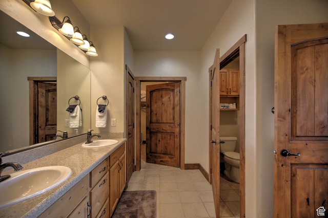 21 Gentle Ben Cir, Fish Haven, ID 83287 - bathroom featuring vanity, toilet, and tile patterned flooring