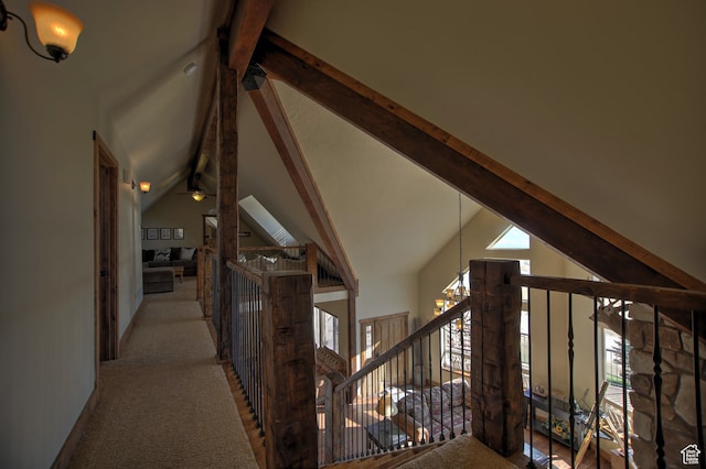 21 Gentle Ben Cir, Fish Haven, ID 83287 - corridor featuring light carpet, high vaulted ceiling, and a healthy amount of sunlight