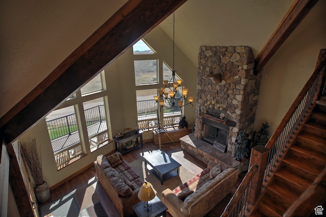 21 Gentle Ben Cir, Fish Haven, ID 83287 - living room with hardwood / wood-style floors, a notable chandelier, a fireplace, and high vaulted ceiling