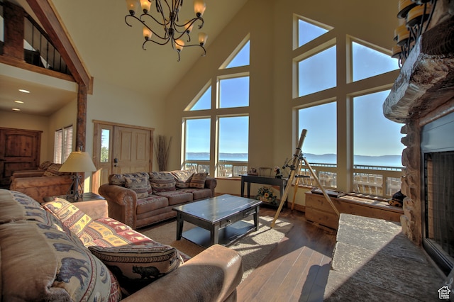 21 Gentle Ben Cir, Fish Haven, ID 83287 - living room with a wealth of natural light, hardwood / wood-style floors, a towering ceiling, and a chandelier