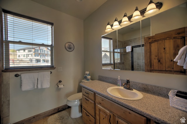 21 Gentle Ben Cir, Fish Haven, ID 83287 - bathroom with vanity, tile patterned flooring, toilet, and an enclosed shower