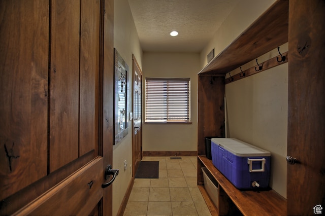 21 Gentle Ben Cir, Fish Haven, ID 83287 - mudroom featuring a textured ceiling and light tile patterned flooring