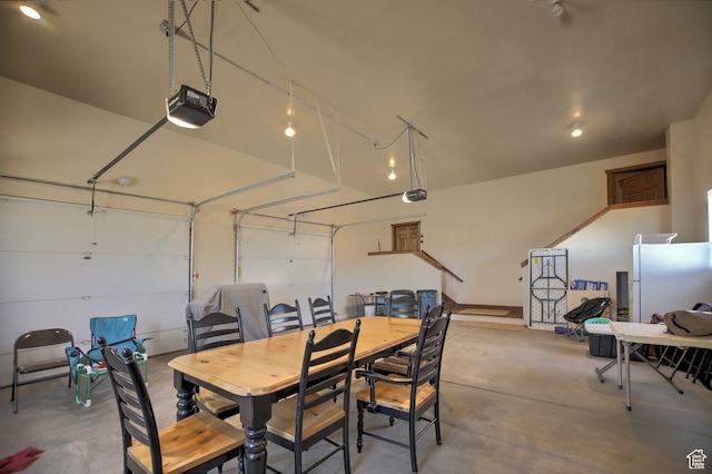 21 Gentle Ben Cir, Fish Haven, ID 83287 - garage featuring a garage door opener and white refrigerator