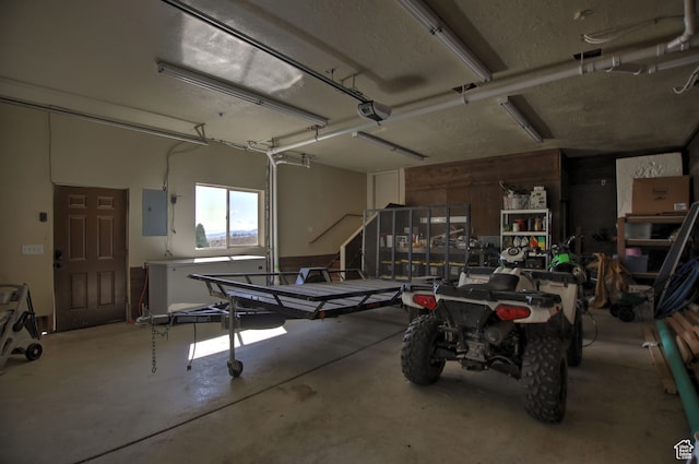 21 Gentle Ben Cir, Fish Haven, ID 83287 - garage featuring a garage door opener and electric panel