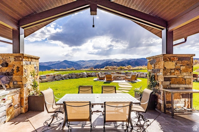 1159 Snow Berry St, Park City, UT 84098 - view of patio with an outdoor living space with a fireplace, a mountain view, and outdoor dining area
