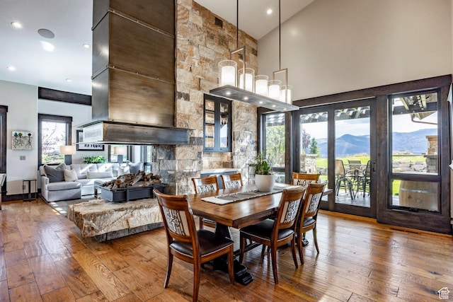 1159 Snow Berry St, Park City, UT 84098 - dining space with hardwood / wood-style floors, recessed lighting, a high ceiling, and a mountain view