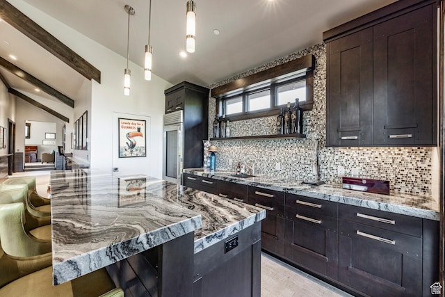 1159 Snow Berry St, Park City, UT 84098 - kitchen with stainless steel built in refrigerator, light stone counters, backsplash, hanging light fixtures, and vaulted ceiling with beams