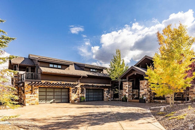 1159 Snow Berry St, Park City, UT 84098 - view of front facade with concrete driveway, a garage, and stone siding