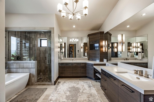 1159 Snow Berry St, Park City, UT 84098 - full bath with a stall shower, an inviting chandelier, a sink, two vanities, and a freestanding tub