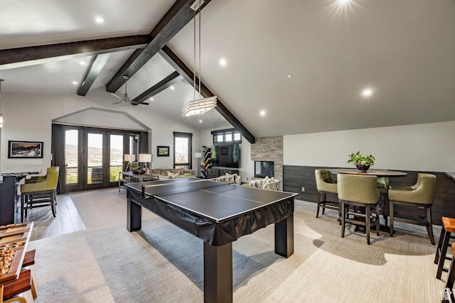 1159 Snow Berry St, Park City, UT 84098 - rec room with lofted ceiling with beams, a fireplace, french doors, and recessed lighting