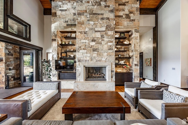 1159 Snow Berry St, Park City, UT 84098 - living area featuring a premium fireplace, a high ceiling, and wood finished floors